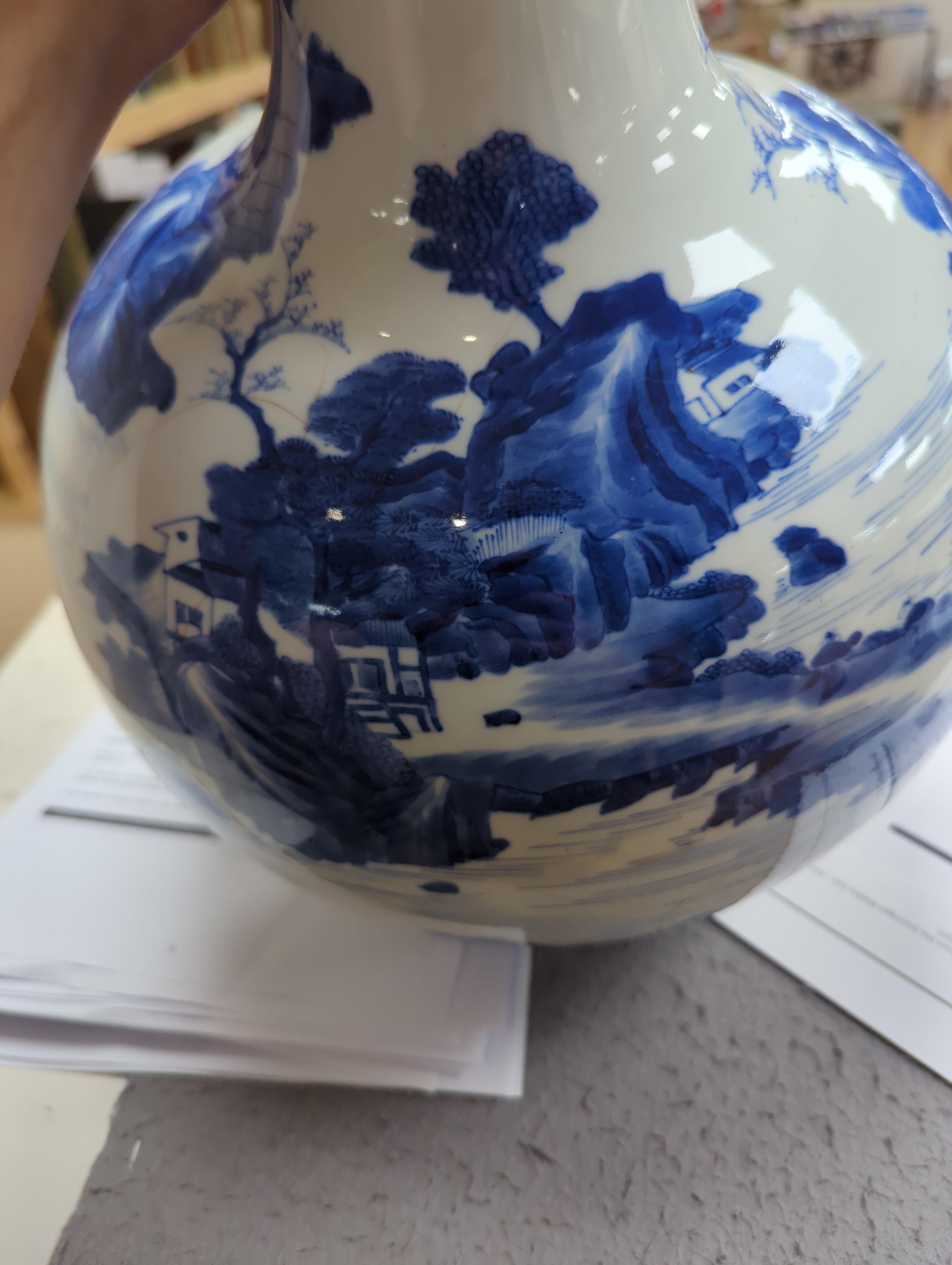 A large Chinese blue and white bottle vase, (a.f) 45cm